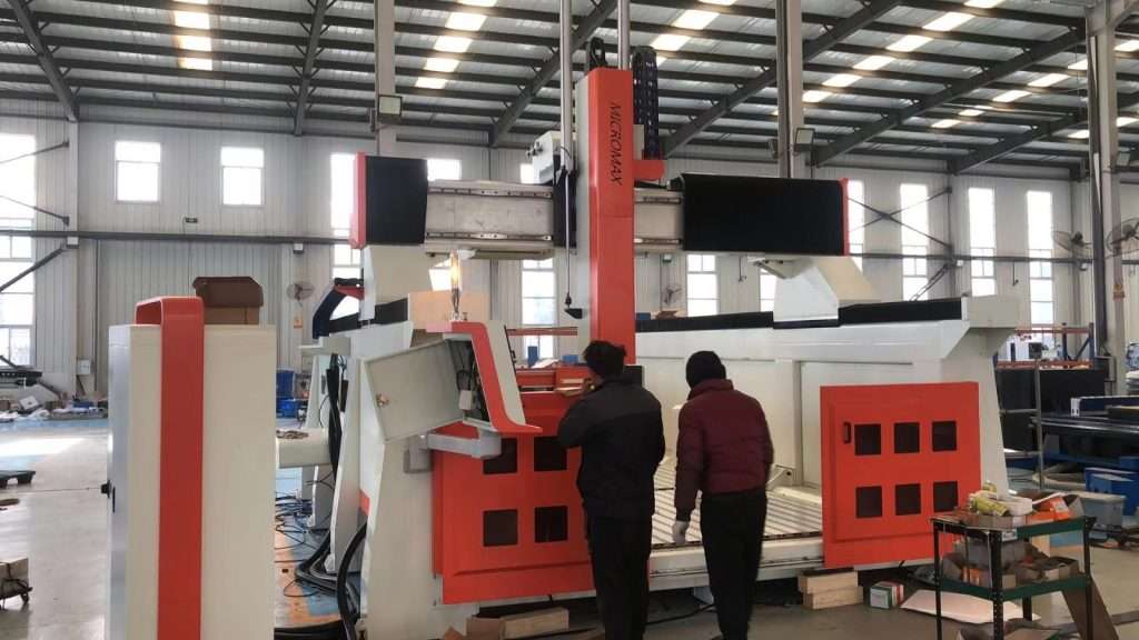 Micromax heavy-duty CNC machine being installed and commissioned in manufacturing facility